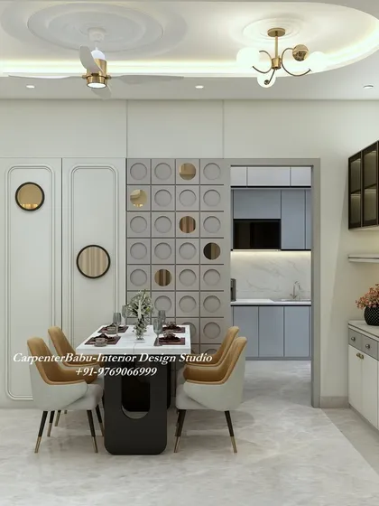 This dining area features a unique wall partition with circular cutouts and gold mirror accents. The design is both functional as a divider and decorative as a feature.
