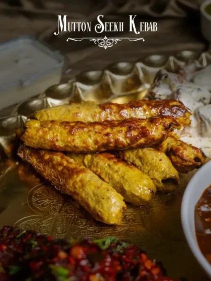 The classic Mutton Seekh Kebab, a staple in our Dostana Thaal. Minced mutton is blended with herbs and spices, then grilled to perfection.