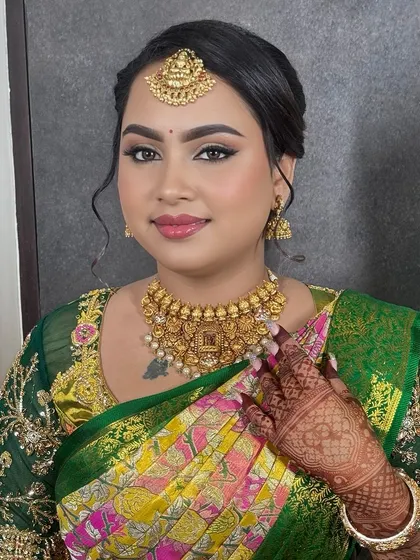 A perfect smile from a happy client. This engagement look was all about creating a flawless canvas to let her joy and the beautiful colors of her saree stand out.