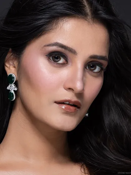 A close-up beauty portrait for a pageant portfolio, focusing on flawless makeup and a confident expression. This shot is perfect for anyone needing a powerful and professional headshot.