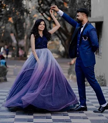 Pratik and Piyusha share a dance during their engagement ceremony. Her beautiful ombre gown and his sharp blue suit make for a stunning and dynamic photograph.