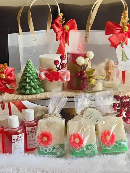 A beautiful display of my Christmas gift collection, including festive soaps, body washes, and a variety of soy wax candles.