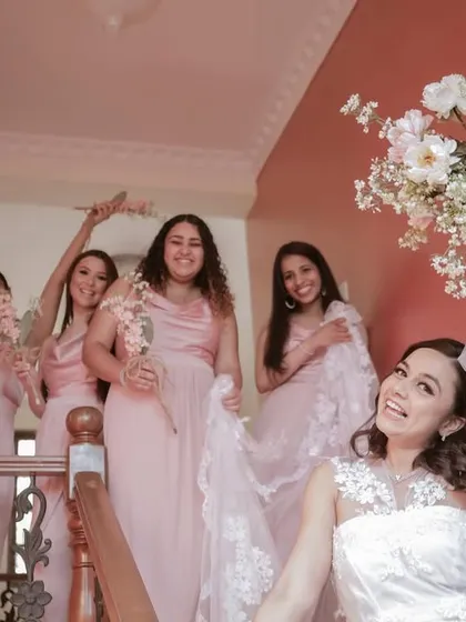 Pure joy! The bride and her squad celebrating on the stairs. We love capturing the energy of the bridal party.