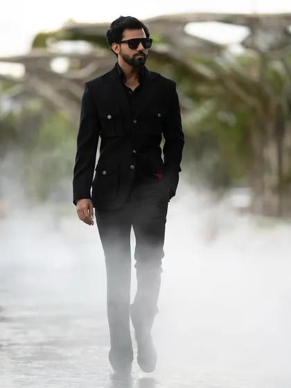 The Viaggio Blazer's unique design stands out, even in a monochromatic outfit.