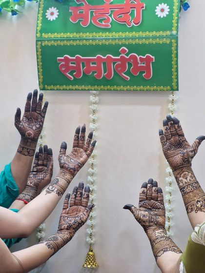 The whole squad with their hands up. This is what a 'Mehendi Samarambh' looks like when everyone joins in on the celebration.