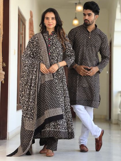 An elegant black and beige set with a mix of floral and geometric block prints. The man's kurta features side pockets for practicality, paired with a free-size pyjama.