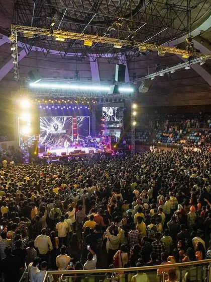 A packed stadium in Delhi during a live concert with Ayushmann Khurrana's band. Performing for thousands of people is an electrifying experience that I bring to every large-scale show.