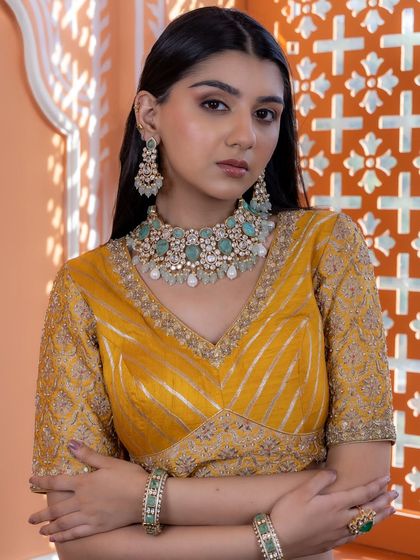 A full view of our mint green Kundan set, complete with choker, earrings, and bangles. This ensemble is a beautiful example of how traditional designs can be refreshed with modern colors.