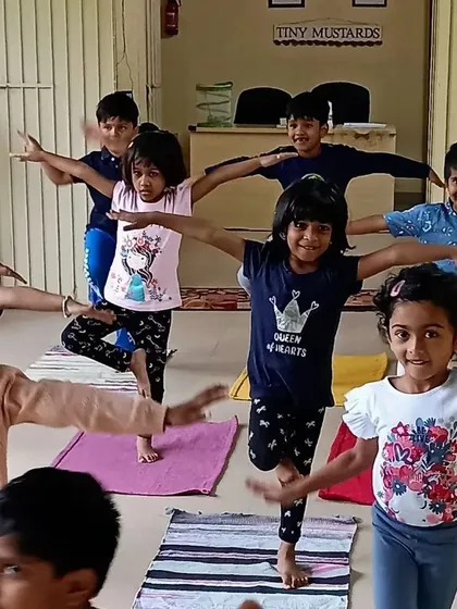 Our little yogis finding their balance during a kids' yoga session. I incorporate mindful movement to help children develop focus, coordination, and a positive connection with their bodies in a playful group setting.