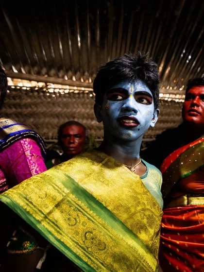 Young participants in the Kulasai festival, their painted faces and colorful sarees reflecting the vibrant energy and community spirit of the event.