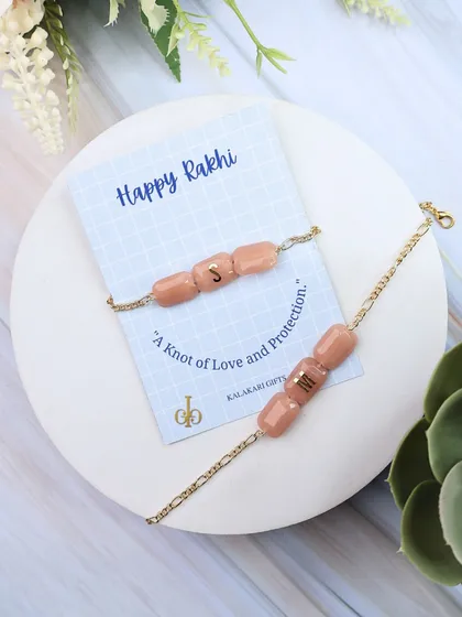 Our personalized Quartz Rakhi in a soft peach color.