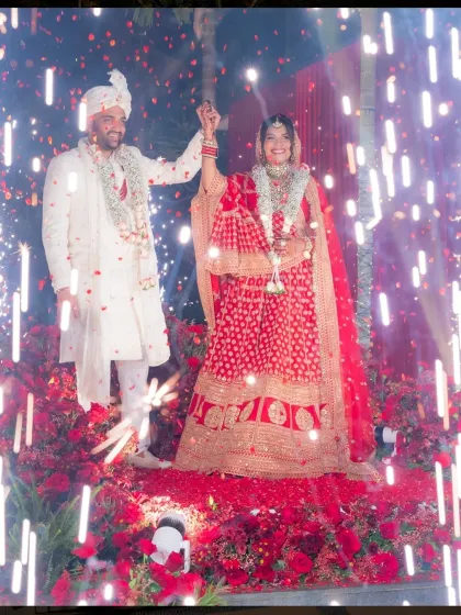 Your entry as a couple is a highlight moment. I design these moments to be unforgettable, using elements like sparklers and a path of roses to create a grand, cinematic experience at this Goa wedding.