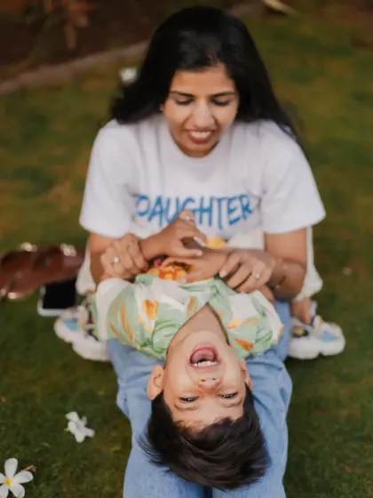 Pure, unfiltered joy. My sessions are all about letting kids be kids, which means lots of laughter and play. This upside-down giggle is exactly the kind of chaotic, happy memory I love to photograph.