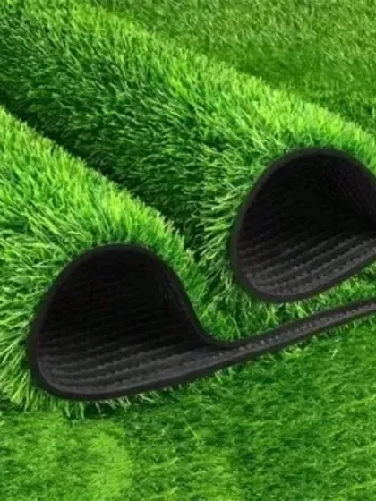 This is a close-up of my artificial grass mat. You can see the dense, multi-toned blades that give it a realistic look, as well as the durable, perforated backing that allows for proper drainage.
