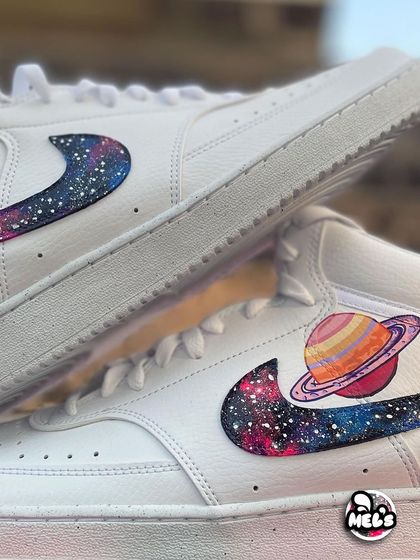 A close-up of the Saturn and galaxy swoosh design on the custom Nike high-top.
