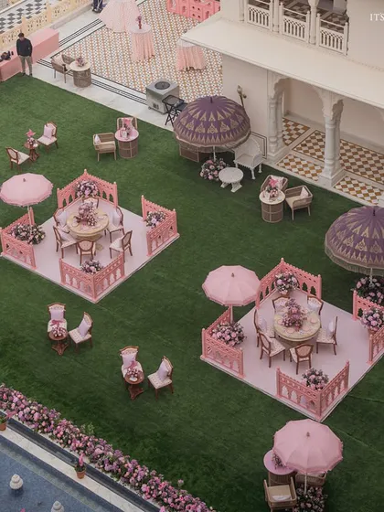 An aerial view of our 'Pink Jaipuri Bagh' mehendi, where we transformed a space with Rajasthani motifs and a vibrant pink palette to celebrate the Pink City.