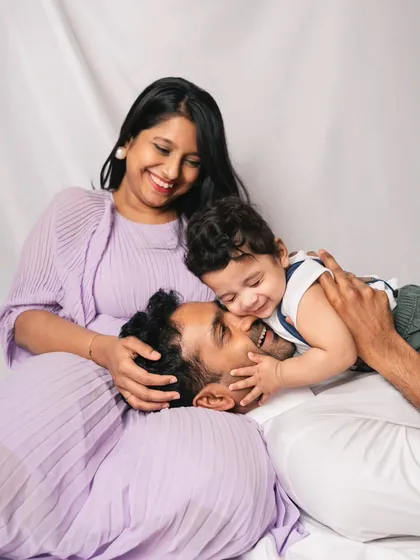 Playful moments like these are my favorite to capture. This photo shows a beautiful, candid interaction between a father and his baby during a relaxed family session.