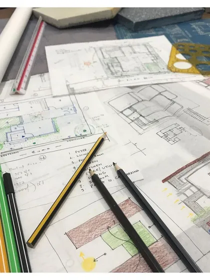 The design process begins here, with layers of hand sketches and site planning. This initial conceptualization phase is crucial for brainstorming ideas, defining spatial relationships, and ensuring the final design is perfectly tailored to the site and the client's vision.