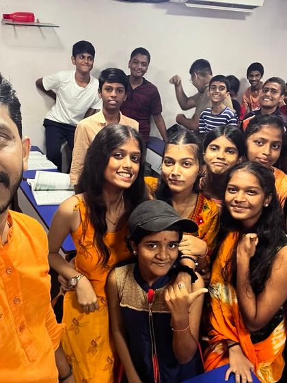 Day 4 of Navratri 2024 was Orange. A selfie with students radiating enthusiasm and warmth.
