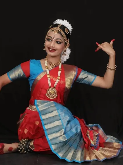 A portrait of Kriti for her Arangetram. The expressive eyes and hand gestures, or mudras, are central to the storytelling aspect of Bharatanatyam.
