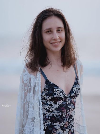 A friendly and approachable smile captured in a close-up beach portrait. I always aim to connect with my subjects to bring out their natural charm.