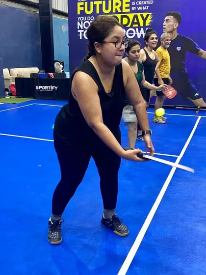 A player gets ready to serve during a Pickleball skills clinic at our Gurgaon facility. We host regular clinics for all levels, helping beginners learn the basics and advanced players refine their dinks and drives.