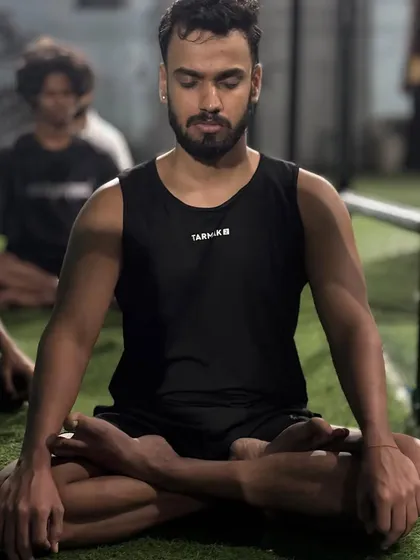 An athlete finding his focus during meditation. A calm mind is a strong mind.
