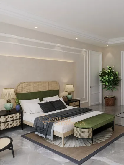 A wider view of the rattan-detailed bedroom, showing the spacious layout which includes a separate seating area.