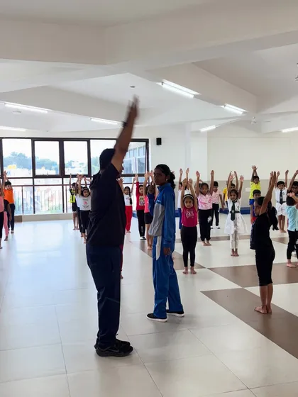 A typical class starts with everyone in sync. I lead the children through warm-ups and stretches, making sure they learn the importance of preparing their bodies for exercise.
