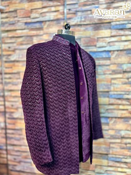 A final look at the elegant drape and texture of our wine velvet Jodhpuri, available for rent at our Mumbai store.