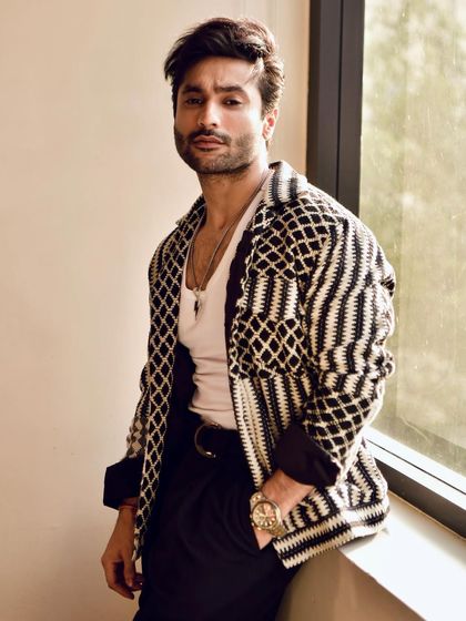 A confident and direct portrait, perfect for a magazine feature or promotional material.