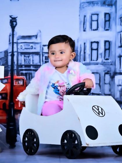 Another shot from the traveler theme, with the baby looking ready for an adventure in her toy car.