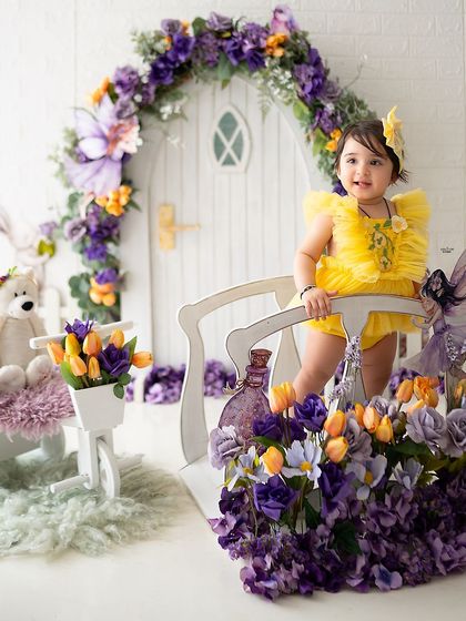 Exploring the enchanted bridge outside her fairy door.