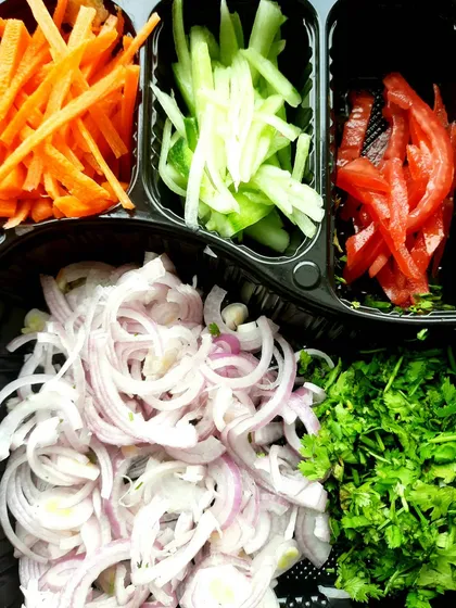 I believe the secret to great food lies in the ingredients. We chop all our vegetables fresh every day. You'll find crisp carrots, cucumbers, onions, and tomatoes in our rolls, adding a fresh crunch to every bite.
