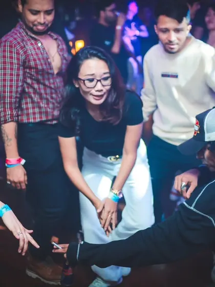 Getting down on the dance floor with the crowd. It's all about connecting with people and sharing the love for dance.