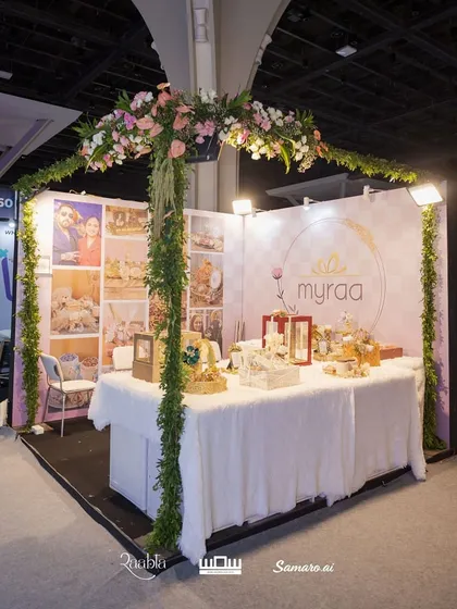 The full view of my beautiful exhibition stall at the WOW Awards. We designed it with a floral arch to create an inviting and luxurious space for visitors.