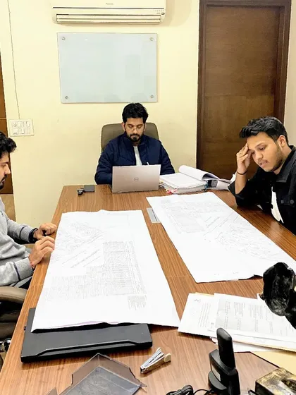 Late nights and detailed reviews are part of the job. Here, my team and I are analyzing project plans to prepare for a case.