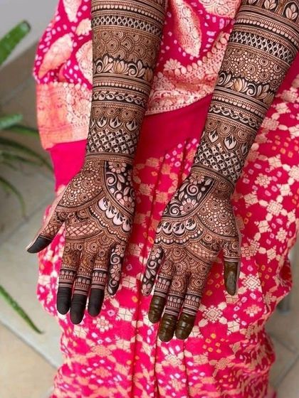 A classic and elegant full-coverage design with beautiful flowing patterns, perfect for a bride who loves traditional aesthetics.
