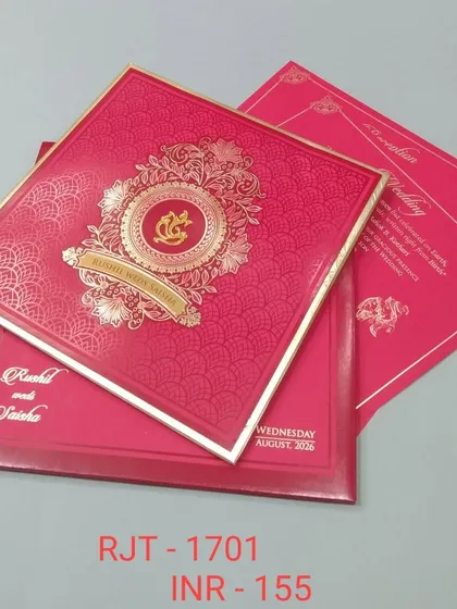A bold red invitation with a gold Ganesha emblem, perfect for making a traditional statement. The card has a luxurious feel with its rich color and metallic accents.