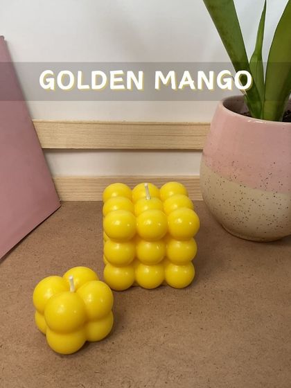Brighten your day with the tropical scent of 'Golden Mango'. These cheerful yellow bubble candles are perfect for adding a splash of color and a fruity fragrance to your room.