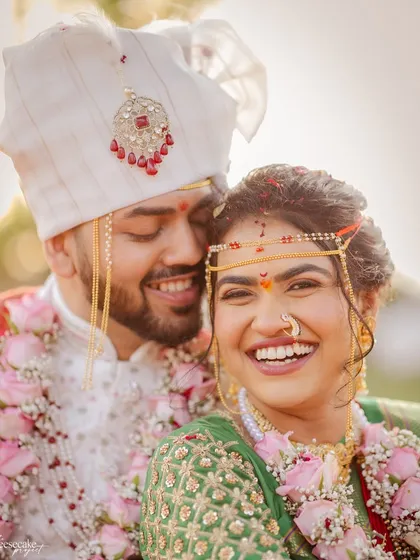 The pure joy of a bride on her wedding day is my biggest inspiration. This close-up shot captures the flawless finish of her makeup, the traditional Maharashtrian details, and most importantly, her radiant, infectious smile.