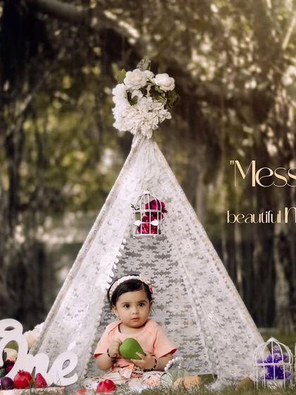 Messy moments and beautiful memories. This little girl enjoys a snack in our whimsical teepee setup under the shade of a banyan tree.