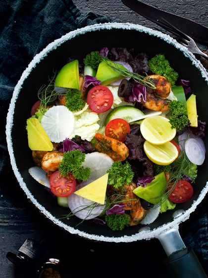 For a luxurious and healthy meal, try our Avocado Prawns Cocktail Salad. It's a beautiful combination of mixed greens, avocado, grilled prawns, and fresh veggies, perfect for a special treat.