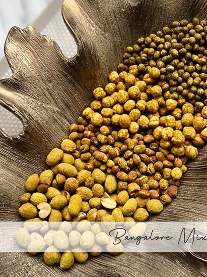 This is my special Bangalore Mixture, a savory trail mix of mixed lentils like peanuts, green gram, and black-eyed beans, all seasoned with turmeric and red chillies.