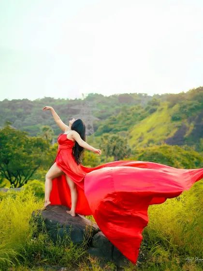 Another angle of the red flying dress, capturing the fabric as it catches the wind. This kind of epic, motion-filled shot is what makes a brand's outdoor campaign unforgettable.
