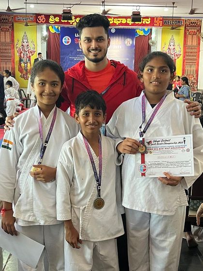 Three of my students with their medals from the district championship. It's rewarding to see their hard work pay off.