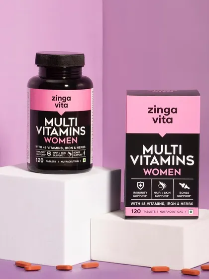 A modern, graphic shot of Zingavita's Multi Vitamins for Women. The use of geometric blocks and a purple color scheme creates a strong, contemporary brand image.