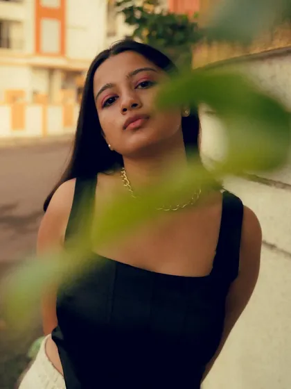 A series of portraits with a warm, vintage color grade. The use of leaves in the foreground of some shots adds depth and a sense of place.