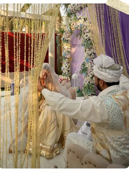 A sacred moment during the Nikah ceremony. The couple is framed by the beautiful decor we designed, showing how the right setting can enhance the emotional depth of the rituals.