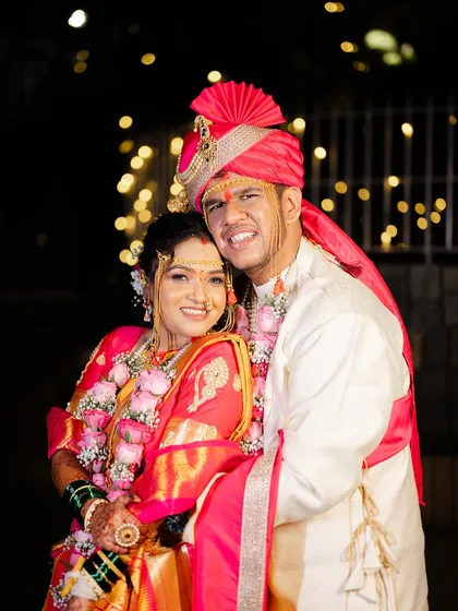 A classic couple portrait, both smiling for the camera, looking picture-perfect.